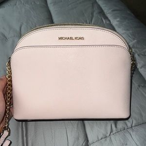 Small, pink Michael Kors purse